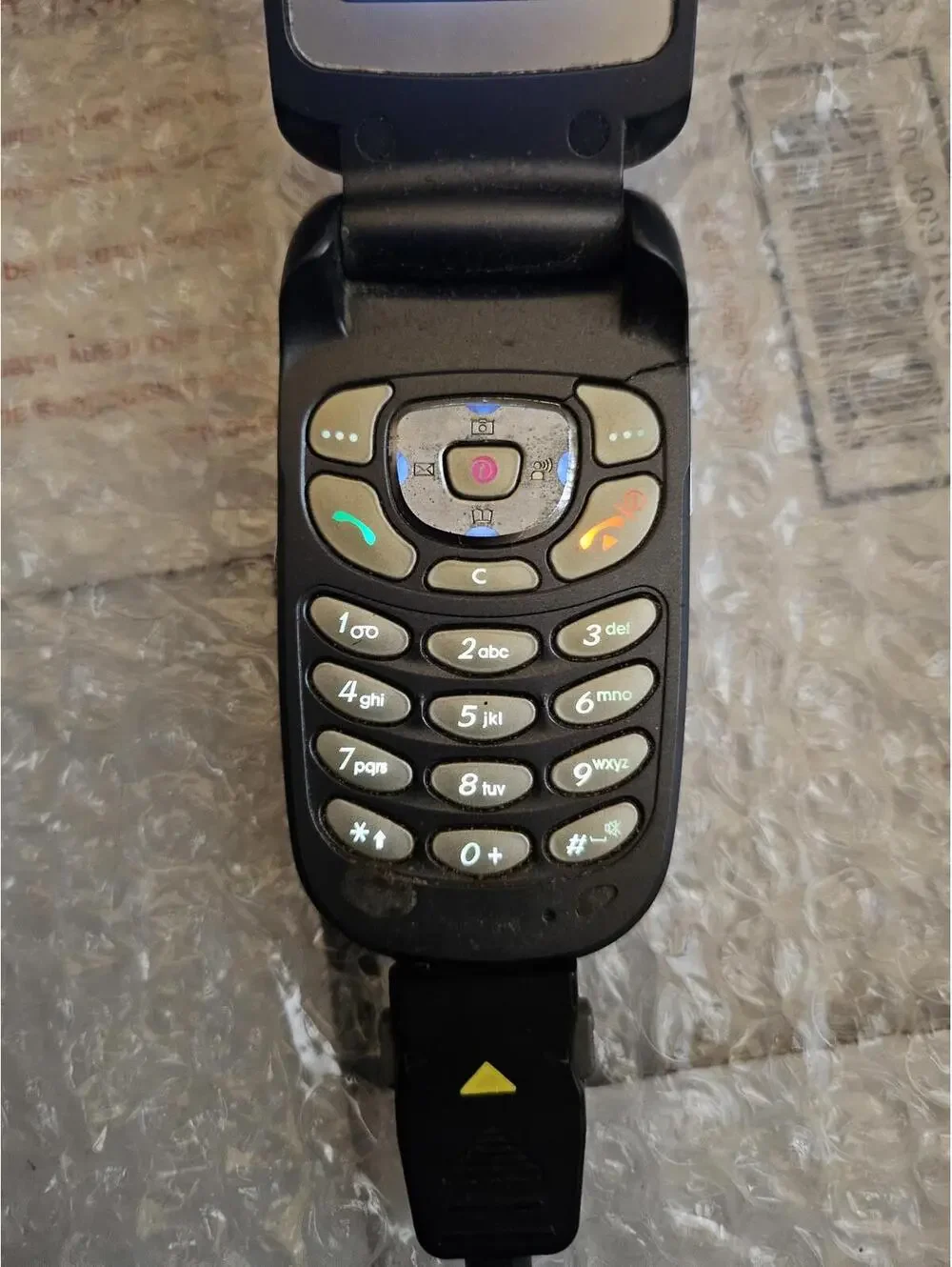 Nice vintage Samsung flip cell phone t-mobile. With Charger. Powers on & charges